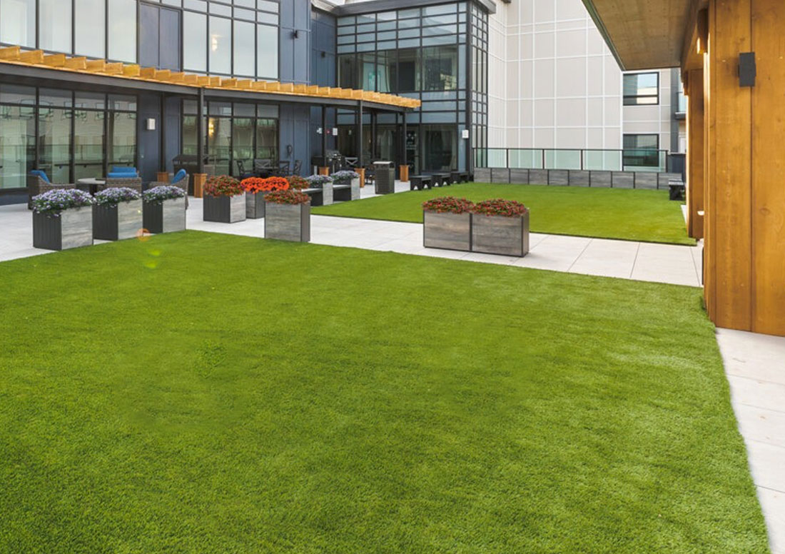 Courtyard with synthetic grass installed