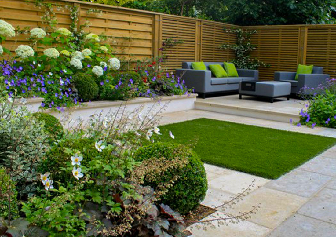 garden with back patio and artificial turf