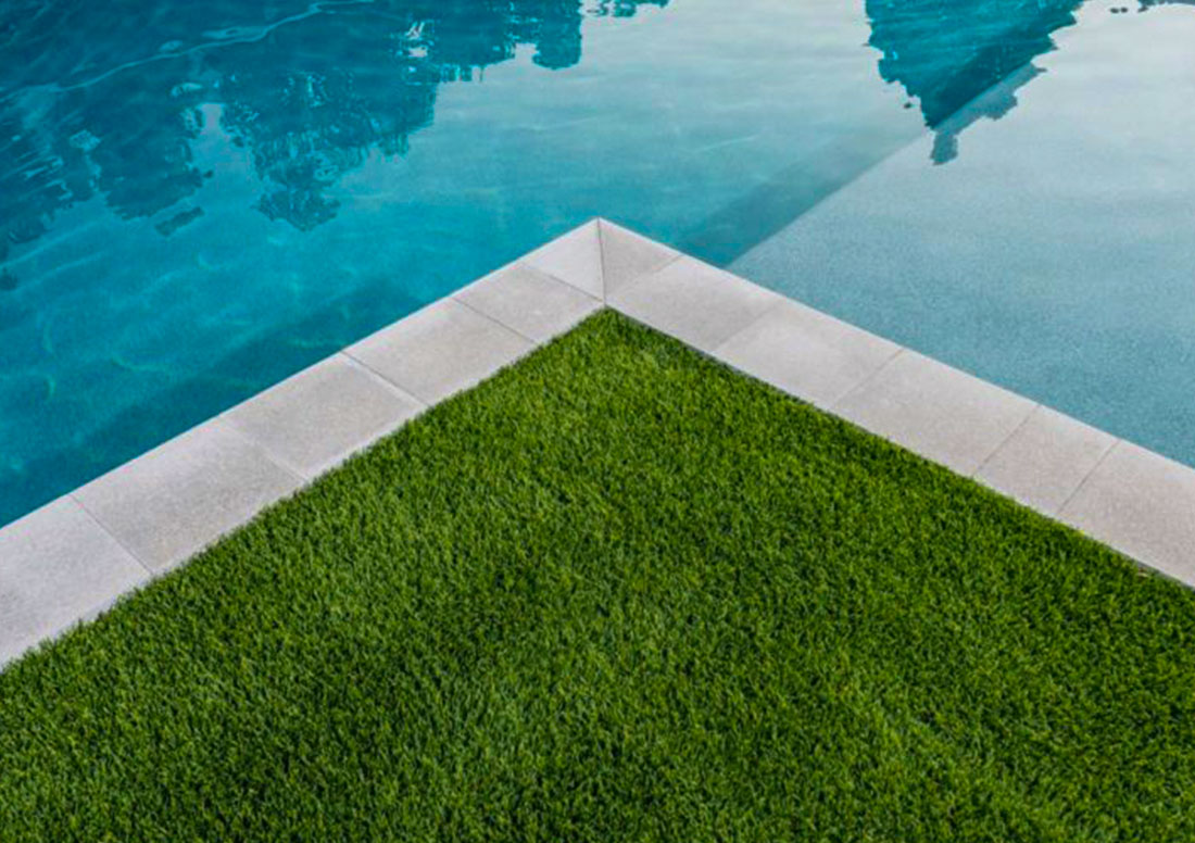 pool next to artificial turf installation