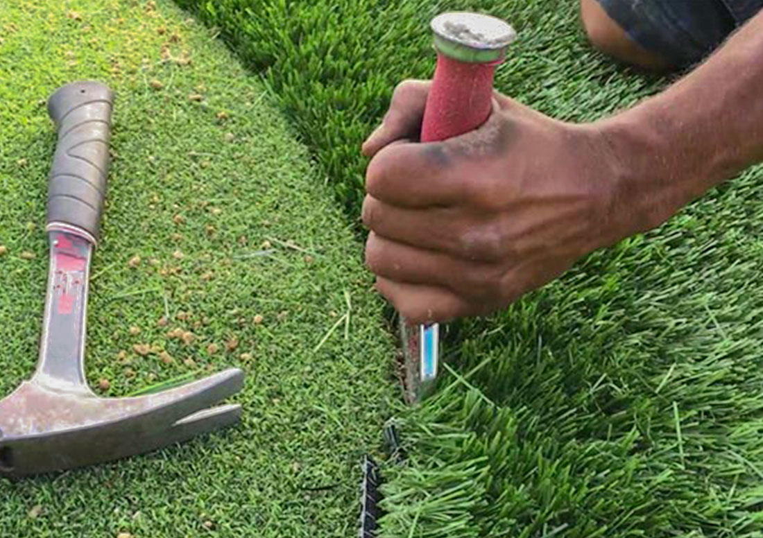 Artificial turf professional installer with tools