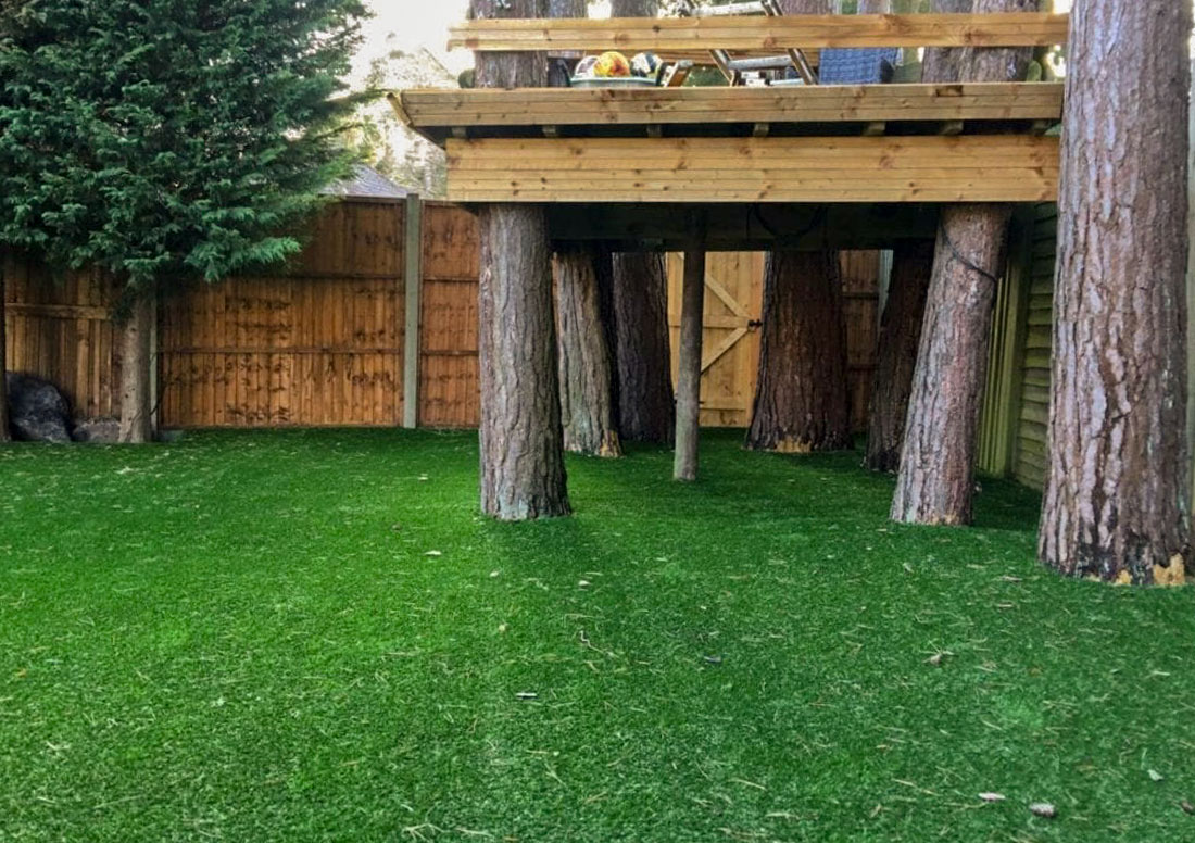 backyard Lawn with trees and artificial turf