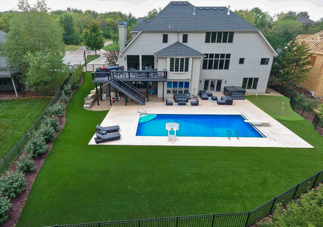 Large Home with pool, putting green and artificial turf installed