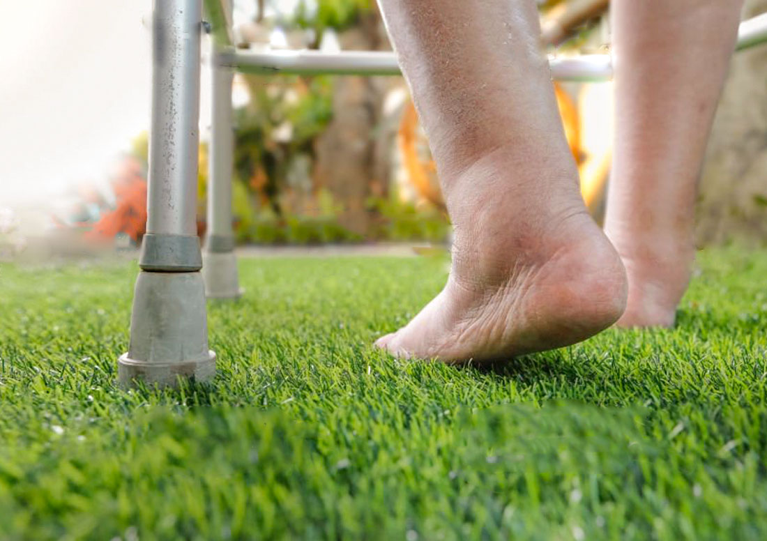 Senior walking on fake grass